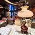 In One City Inn, Taichung City lounge with bookshelves, magazine displays and a decorative table lamp