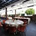 Thunder Valley Casino Resort in Lincoln: covered outdoor dining terrace with round tables and red chairs