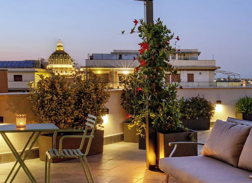 Hotel Alessandrino Rome rooftop terrace with city views and St. Peter's Basilica in the distance