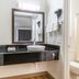Red Roof Inn Phoenix-Midtown bathroom with vanity, sink, mirror, and shower-tub combo in Phoenix