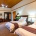 Evergreen Manor and Spa, Stellenbosch: elegant guest room with twin beds, antique furniture and wood ceiling