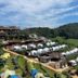 Mon Ing Dao in Mae Rim with hillside dome tents, green terraced slopes, and a clear sky