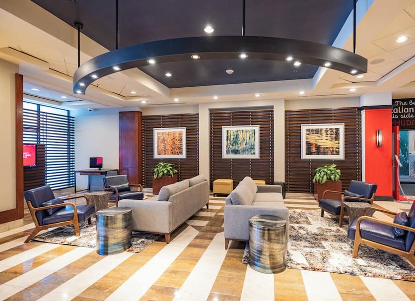 Sheraton Lincoln Harbor Hotel in Weehawken lobby seating area with modern lounge chairs and artwork