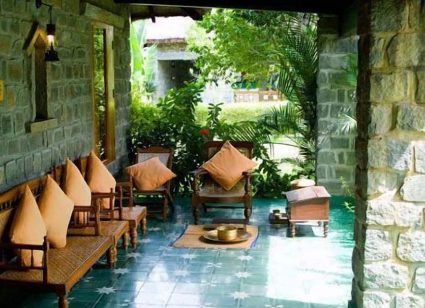 Halez Sparsa Thiruvannamalai in Tiruvannāmalai, stone patio seating with garden view