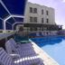 C Hotel Tiberias pool deck with lounge chairs, shaded seating and mountain views