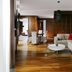 Minsk Marriott Hotel suite with living area, white sofa, dining table and wood floors in Minsk