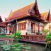 Khaolak Bhandari Resort & Spa in Khao Lak, Thai-style villas beside a lotus pond at sunset