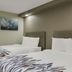 Red Roof Inn & Conference Center Chicago - Aurora Fox Valley twin room with two beds and wall art