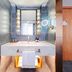 James Joyce Coffetel Hotel Qinhuangdao bathroom vanity with backlit mirror and sink