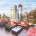 Wyndham Midtown 45 rooftop terrace in New York with city skyline views and lounge seating