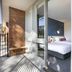 Nightcap at Sandown Park Hotel in Noble Park balcony view into bedroom with bed and sliding glass door