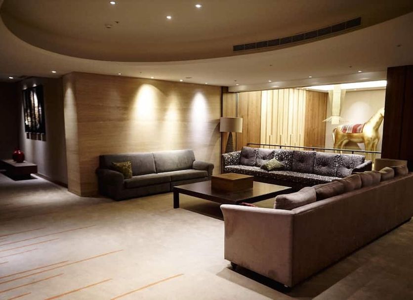 Beitou Hot Spring Resort lobby lounge in Taipei City with sofas, coffee table and warm lighting