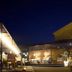 Hotel del Teatre in Regencós at night, with an outdoor terrace and lit stone building