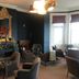 West Rocks Townhouse, Eastbourne: elegant lounge with seating, fireplace, and large windows