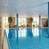Van Der Valk Hotel Ara in Zwijndrecht indoor pool with large windows and lounge chairs