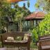 Pousada Alfa e Ômega in Alto Paraíso de Goiás with tropical garden seating and cottage view