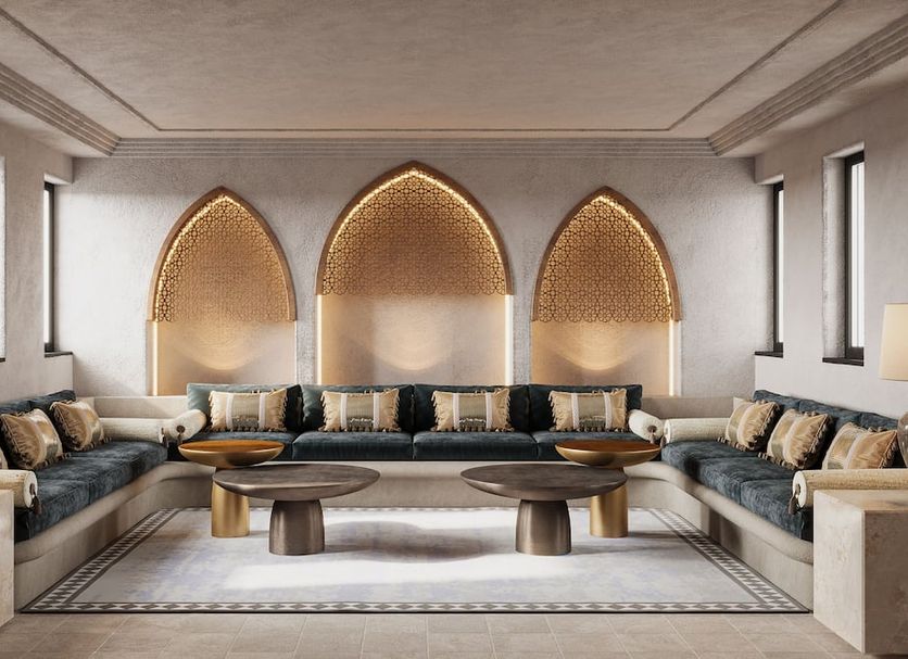 Jumeirah Dar Al Masyaf Dubai lounge with arched gold wall niches and sectional seating