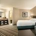 DoubleTree Resort by Hilton Hotel Lancaster guest room with king bed and sitting area in Lancaster