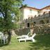 Agriturismo La Capitata in Pian di Scò with stone terrace, lawn, and outdoor lounge chairs