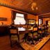 Alaska Heritage House Bed And Breakfast in Fairbanks, ornate historic dining room with long table and patterned rug