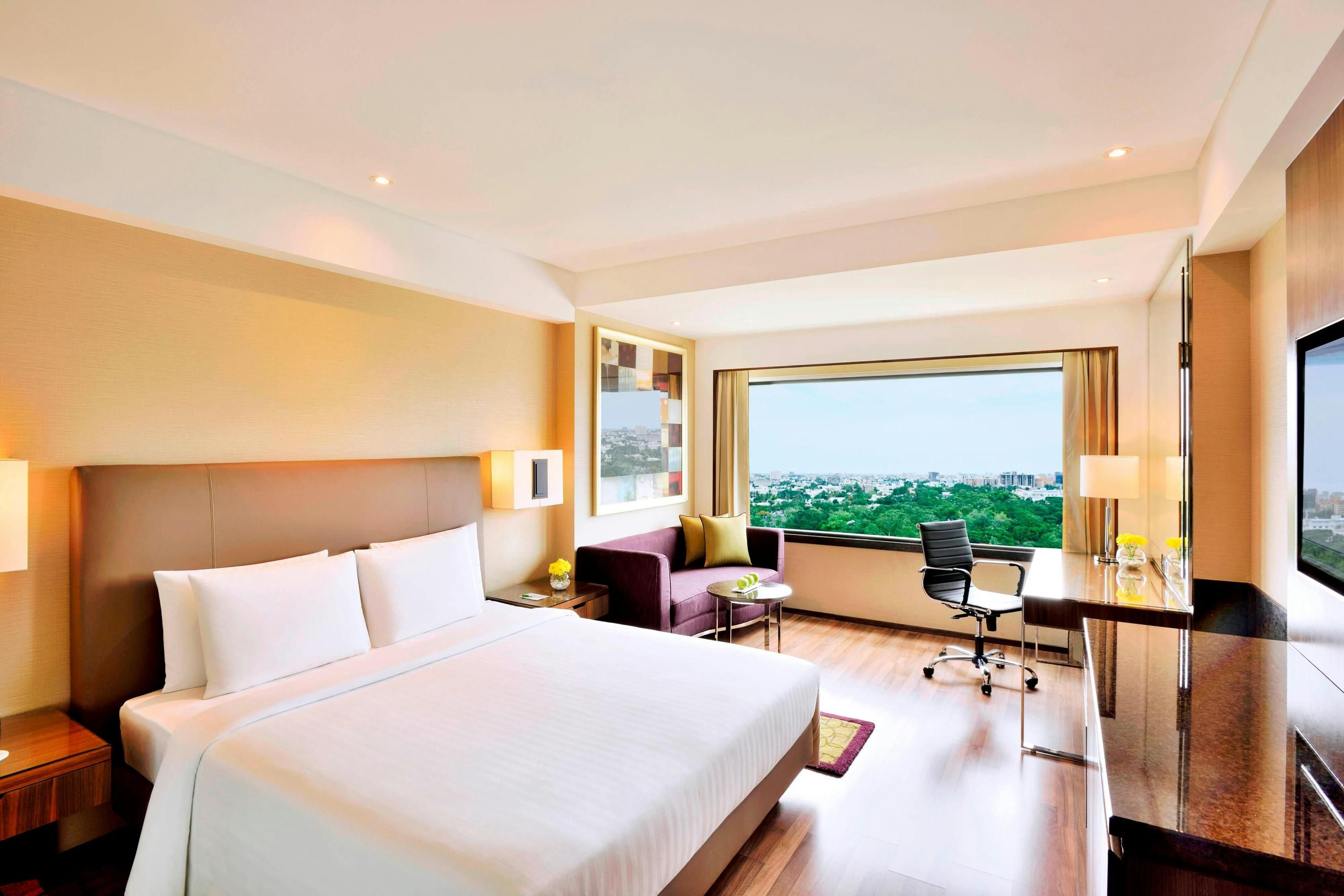 Courtyard by Marriott Chennai room with king bed, city view, desk and chair