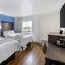 SureStay Plus by Best Western Niagara Falls East guest room with two beds and a window view
