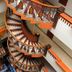 Hotel Báez Carrizal in Villahermosa, interior spiral staircase with orange and brown railings