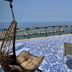 Domus Maris Relais Boutique Hotel in Sciacca: rooftop terrace with sea view and hanging chair