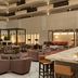 Embassy Suites by Hilton Phoenix Downtown North lobby with seating, bar tables and multi-level atrium