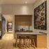 The Wellem Düsseldorf suite with bedroom, kitchenette, and dining area