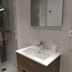 Chalet Appart'Hôtel l'Eau Vive bathroom with sink, mirror, and glass shower in Saint-Nicolas-la-Chapelle