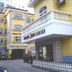 Home Inn Da Mu Qiao Shanghai exterior with yellow facade, arched windows and driveway