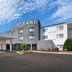 Courtyard by Marriott Johnson City exterior with covered entrance and cloudy blue sky