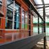 Wood House Pattaya in Pattaya features a wood-decked balcony with metal railing and glass doors