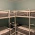 Svea Hostel Stockholm bunk room with four single beds and light green walls