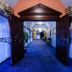 Hotel Wellness & Spa Nowy Dwór in Świlcza, blue-carpeted hallway with dark wood double doors