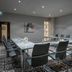 Maldron Hotel Dublin Airport meeting room in Dublin with conference table and black chairs