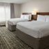 Fairfield Inn & Suites by Marriott Tampa Westshore/Airport guest room with two queen beds and window