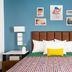 Uptown Suites Extended Stay Denver Co - Centennial guest room with blue wall, bed, and bedside lamps