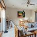 Desa Swan Villas & Spa, Keramas villa living room with seating and patio doors to sun loungers