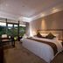 New Century Hotel Guian Guizhou in Anshun guest room with large window and mountain view