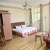 eXo Hotel Franka Bamberg - by NeVo Hotels room with bed, sofa, TV and windows in Hallstadt