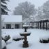 The Connecticut River Valley Inn in Glastonbury, snow-covered courtyard with trees and patio