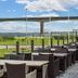 Hotel Pinenhus in Glyngøre with outdoor terrace seating overlooking water and a bridge