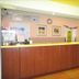 Home Inn Da Mu Qiao Shanghai reception desk with wooden front and yellow counter