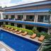 Phangan Island View - Sha Extra Plus in Ko Pha Ngan: courtyard pool with loungers and two-story balconies