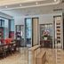 Xiamen Junming Hotel lobby in Xiamen with polished floors, seating, and floral decor