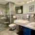 Zeitwohnhaus Suite-Hotel & Serviced Apartments in Erlangen bathroom with walk-in shower and wall-mounted sink