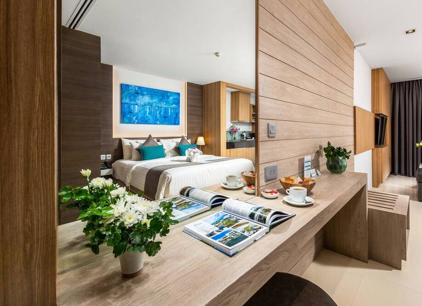 Kudo Hotel & Beach Club (Adults Only) Patong room with king bed, desk, seating area and balcony view
