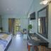 Golden Coast Hotel & Bungalows room in Marathon with balcony view, twin beds, desk and wall-mounted TV